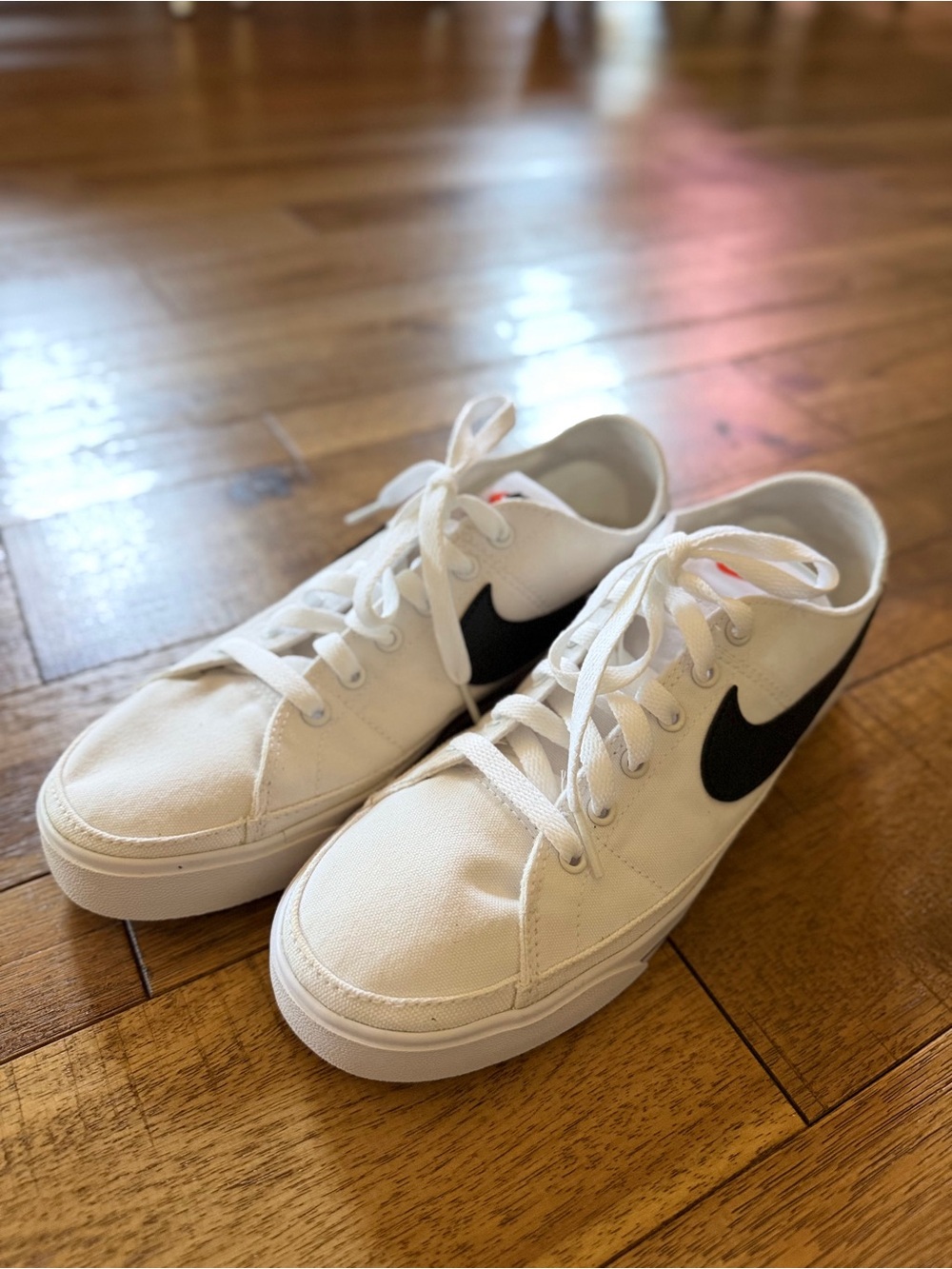 Nike White Canvas Low-Top Sneakers with Black Swoosh